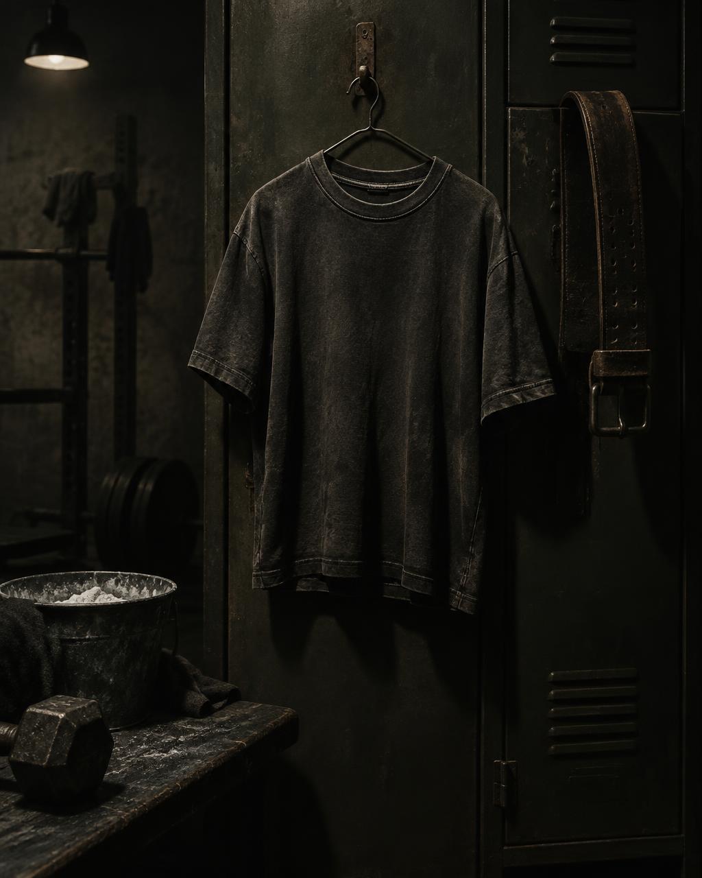 Stone washed Fit Legion tee hanging in a dark gym locker room